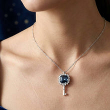 Load image into Gallery viewer, Woman wearing Azure Blue crystal key pendant silver necklace with a blue crystal key pendant