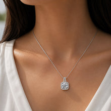 Load image into Gallery viewer, Woman wearing MysticFlavia moissanite pendant necklace, close-up on neck and collarbone.