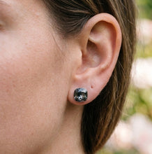 Load image into Gallery viewer, Black Florentine crystal silver earrings worn on a model’s ear.