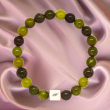 Load image into Gallery viewer, Canadian Jade Infinity Silver Bead Bracelet 8mm displayed on soft satin fabric highlighting natural green jade gemstone beads
