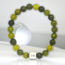 Load image into Gallery viewer, Natural Canadian Jade Infinity Silver Bead Bracelet 8mm standing display featuring green jade gemstone beads and silver infinity charm