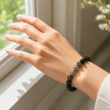 Load image into Gallery viewer, Jade Stone Silver Bead Bracelet 8MM worn on a female wrist with natural green jade beads and silver bead accents