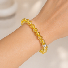 Load image into Gallery viewer, MysticFlavia yellow crystal bead bracelet worn on wrist with a 925 sterling silver accent bead