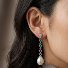 Load image into Gallery viewer, MysticFlavia silver pearl drop earring with green and pink gemstones worn on a model’s ear