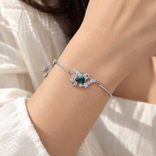 Load image into Gallery viewer, MysticFlavia Swarovski crystal bracelet featuring a teal centerpiece and sparkling butterfly-inspired design