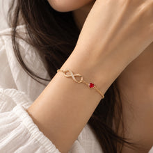 Load image into Gallery viewer, MysticFlavia gold infinity heart bracelet worn elegantly on a wrist