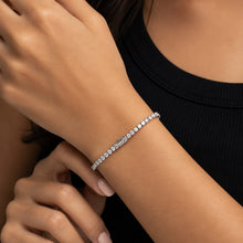 Load image into Gallery viewer, MysticFlavia moissanite tennis bracelet, 925 sterling silver, worn on wrist against black outfit.