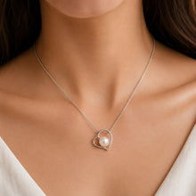 Load image into Gallery viewer, Silver heart pearl pendant necklace worn on a model