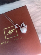 Load image into Gallery viewer, Natural pearl necklace with swan pendant displayed on MysticFlavia jewelry card