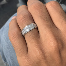 Load image into Gallery viewer, MysticFlavia moissanite ring worn on a finger, highlighting the wide double-row stone setting and polished band.