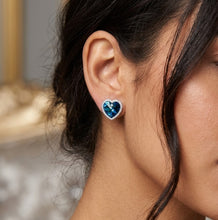 Load image into Gallery viewer, Model wearing Ocean of Heart blue crystal silver heart-shaped stud earrings.