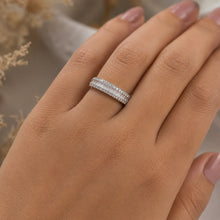 Load image into Gallery viewer, MysticFlavia eternity band ring worn on a model’s finger, highlighting its refined sparkle