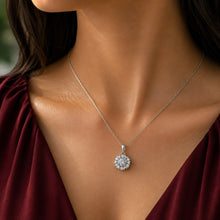 Load image into Gallery viewer, Woman wearing MysticFlavia moissanite flower pendant necklace, close-up on neck.