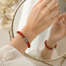 Load image into Gallery viewer, Female model wearing Natural Red Coral Silver Bead Bracelet 8mm with 925 Sterling Silver beads in a mirror reflection