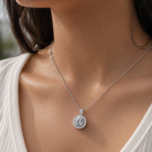 Load image into Gallery viewer, Woman wearing MysticFlavia moissanite pendant necklace, close-up on neck, 2 ct queens design.