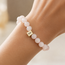 Load image into Gallery viewer, MysticFlavia infinity bead bracelet styled on wrist in soft natural light