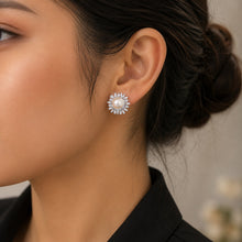 Load image into Gallery viewer, Snowflake pearl pavé zircon silver earring worn on a model’s ear in a close-up view