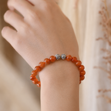 Load image into Gallery viewer, Natural sunstone bracelet with 925 sterling silver carved beads worn on wrist, close-up lifestyle shot