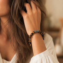 Load image into Gallery viewer, Woman wearing MysticFlavia tiger eye bracelet on wrist, lifestyle shot