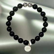 Load image into Gallery viewer, MysticFlavia black tourmaline bracelet with silver beads and round charm, grey satin background