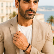 Load image into Gallery viewer, Man wearing MysticFlavia black tourmaline silver beads bracelet, smart casual outdoor portrait