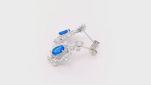 Load and play video in Gallery viewer, Snowflake Blue Topaz Dangling Silver Earrings
