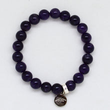 Load image into Gallery viewer, Amethyst bracelet with round 8MM beads and silver charm on white background by MysticFlavia