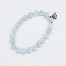 Load image into Gallery viewer, Natural aquamarine birthstone bracelet with 925 sterling silver round charm, flat lay angled view on white background