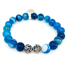 Load image into Gallery viewer, Blue Striped Agate bracelet with two carved silver spacer beads between blue stone beads