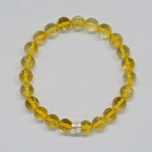 Load image into Gallery viewer, Citrine bracelet with round golden gemstone beads and silver accent bead on a white background