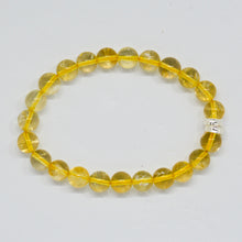 Load image into Gallery viewer, MysticFlavia natural citrine gemstone bracelet shown flat with translucent yellow beads and silver bead