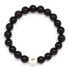 Load image into Gallery viewer, Top view of Garnet Birthstone Infinity Silver Bead Bracelet 8mm featuring natural garnet beads and silver infinity centerpiece