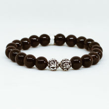Load image into Gallery viewer, Angled view of Garnet Birthstone Silver Bead Bracelet 8MM showcasing polished garnet gemstone beads and sterling silver accent beads
