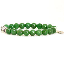 Load image into Gallery viewer, Side view of MysticFlavia green jade-style beaded bracelet with engraved silver bead and round charm on white background.