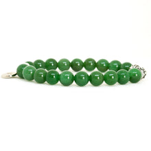 Load image into Gallery viewer, Natural green stone beaded bracelet laid flat showing smooth round beads with filigree silver bead accent.