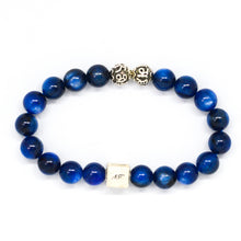 Load image into Gallery viewer, Side view of MysticFlavia Blue Kyanite infinity round silver bracelet 8mm with 925 sterling silver accents
