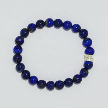 Load image into Gallery viewer, Lapis lazuli bracelet 8mm flat lay showing double flat 925 sterling silver bead on right side on white background