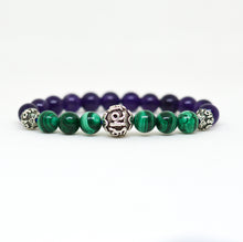 Load image into Gallery viewer, Malachite and Amethyst bracelet side view showing carved silver bead centered among beads