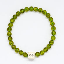Load image into Gallery viewer, Peridot Stone Infinity Silver Bead Bracelet 8mm with 925 Sterling Silver infinity bead on a white background | MysticFlavia