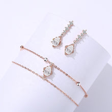 Load image into Gallery viewer, Rose Gold White Zircon Bracelet & Earring Set displayed on a white background by MysticFlavia.