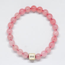 Load image into Gallery viewer, Rose quartz bracelet with round pink beads and infinity charm on white background by MysticFlavia