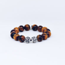 Load image into Gallery viewer, Tiger eye stone silver beads bracelet 12mm close-up showing engraved silver accent beads