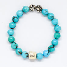 Load image into Gallery viewer, Turquoise round infinity silver bracelet with vivid blue beads, two carved silver beads and square 925 sterling silver infinity charm, white background