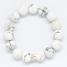 Load image into Gallery viewer, White howlite bracelet 12mm flat view with double gold-tone flat silver spacer bead on white background