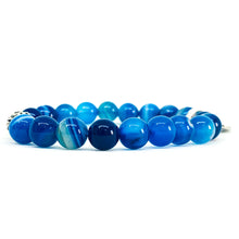 Load image into Gallery viewer, Blue Striped Agate bracelet side view showing rounded beads lined up with silver spacer