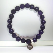 Load image into Gallery viewer, Close-up amethyst bracelet with polished beads and silver charm by MysticFlavia
