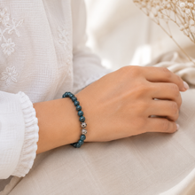 Load image into Gallery viewer, Natural Blue Apatite Healing Crystal Bracelet 8mm Worn on Female Wrist with 925 Sterling Silver Charm
