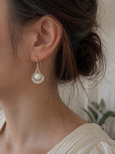 Load image into Gallery viewer, Silver pearl drop earrings with round white pearls displayed on a white background.

