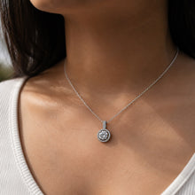 Load image into Gallery viewer, Woman wearing MysticFlavia moissanite pendant necklace, close-up on neck and collarbone, 925 sterling silver.
