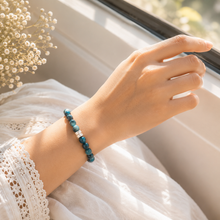 Load image into Gallery viewer, Woman wearing Blue Apatite Stone Double Flat Silver Bead Bracelet 8mm by MysticFlavia with natural blue apatite gemstone beads and double flat 925 sterling silver beads.
